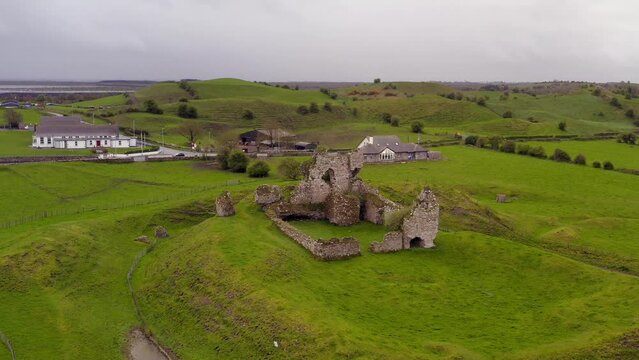 Clonmacnoise castle on overcast day. Aerial establishing shot