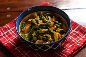 Dahi Bhindi or Okra made with yogurt and Indian spices seved in a bowl.