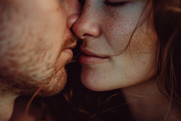 A close-up shot capturing the intimate moment of a man kissing a woman. Perfect for romantic themes and expressions of love