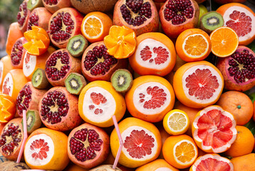 Pomegranates, grapefruit, kiwis, and oranges  at a fruit stand in Istanbul, Turkey