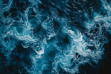 Abstract aerial view of dark blue ocean waves, top down view