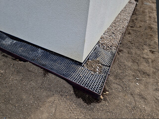 around the house it is always necessary to create a gutter path made of gravel and pebbles. serves  absorb water and ventilate the walls of the house. installation of curb steel sheets. membrane foil