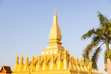 Naklejka premium Pha That Luang bright golden stupa of buddhist temple in vientiane laos