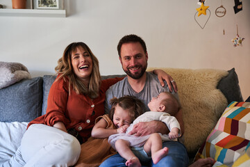 Happy family in the sofa in the living room