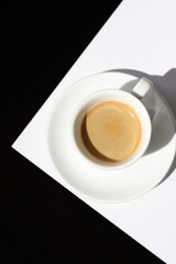 Espresso. Cup of  Espresso Coffee with Crema Foam on Table.