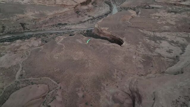 Paramotor flying above plains of Utah, South of Salt Lake City. Aerial