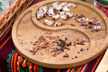 street fair, varios dishes, slicing on a  wooden tray