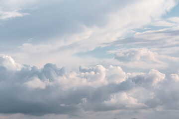 Soft, expansive cloudscape with serene blue and white hues ideal for backgrounds in design and social media. Versatile for themes of calmness and inspiration