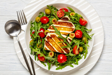 salad with grilled halloumi greek cheese in bowl