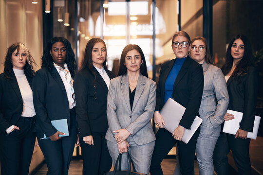 Diverse group of confident businesswomen standing in an office lobby