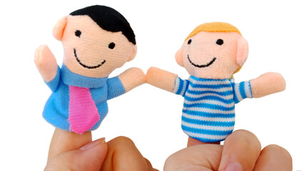 Two fingers wearing puppets; father and son. Kid playing fingers puppets. Finger theater isolated...