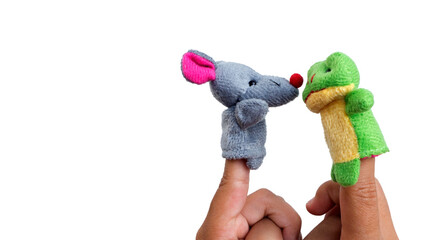 Two fingers wearing puppets; mice and frog. Kid playing finger puppets. Finger theater isolated on...