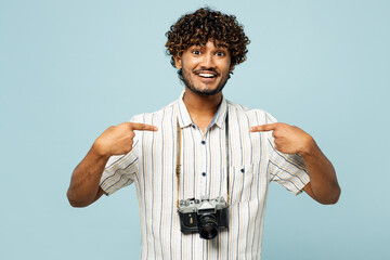 Traveler Indian man wear white casual clothes point index fingers on himself isolated on plain blue...