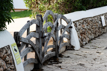 typical wooden gates in Menorca for paths and driveways made from split wood