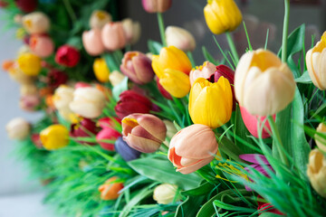 Colorful artificial tulips background. Flowers background.