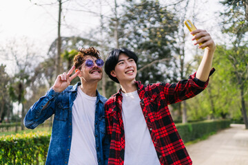 Chinese and Latino gay men share a joyful selfie, capturing their love and diversity