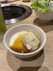 vanilla pudding with melted palm sugar and vanilla ice cream