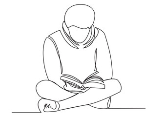 the boy is reading a book