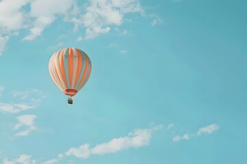 Colorful Striped Hot Air Balloon Floating Across a Clear Blue Sky in a Whimsical Outdoor Adventure