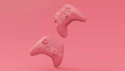 Video game joysticks or gamepads in plain monochrome pink color background