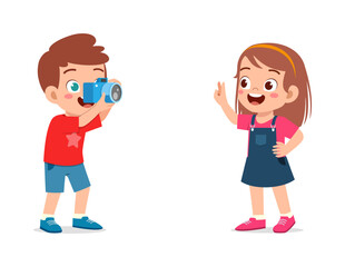little kid holding camera and take photo of friend
