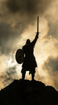 Silhouette of a viking warrior victorious in battle raising his sword