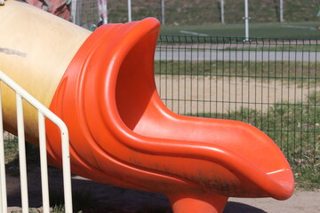 A slide on the playground seen from close up.