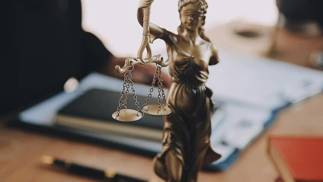 Justice lawyer meeting with contract papers and Judge gavel on tabel in courtroom. Attorney working in courtroom. Justice and law, attorney, court judge concept.