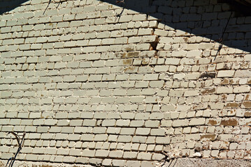 wall of an old building made of white sand-lime brick