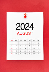 August 2024 calendar page with push pin on red background.
