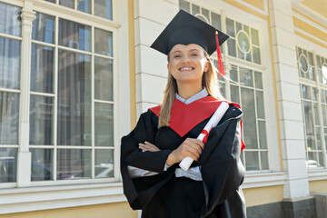A young girl, a university graduate, in a robe.