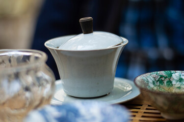 Traditional chinese white porcelain teapot on the table. Tea ceremony