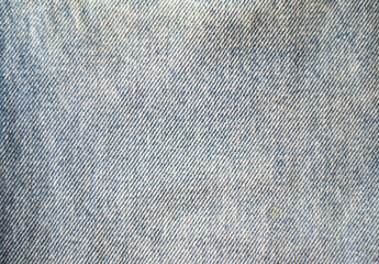 Texture of blue jeans denim close up
