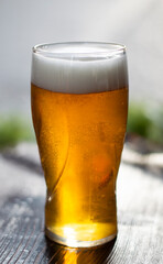Glass of beer on the table in a restaurant, close-up