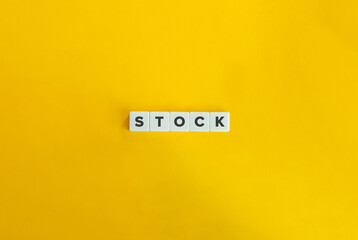 Stock Word and Banner. Text on Block Letter Tiles on Yellow Background. Minimalist Aesthetics.