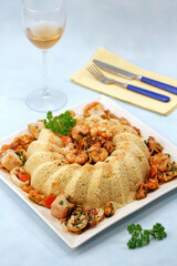 Crown shaped couscous with seafood.