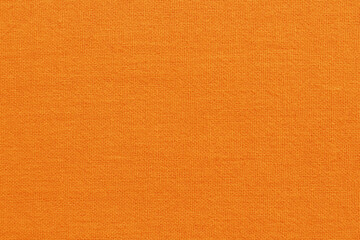 Orange cotton fabric cloth texture for background, natural textile pattern.