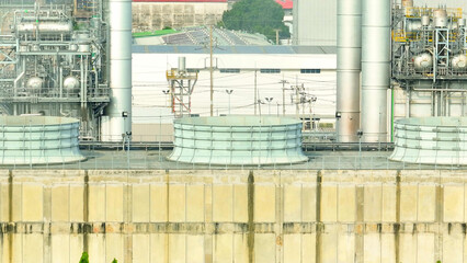An aerial perspective reveals a green energy power plant nestled, harmonizing with nature as it...