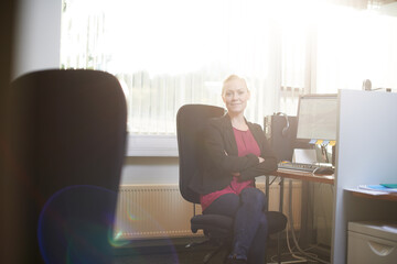 Business woman, portrait and arms crossed at office desk for human resources job, planning and...