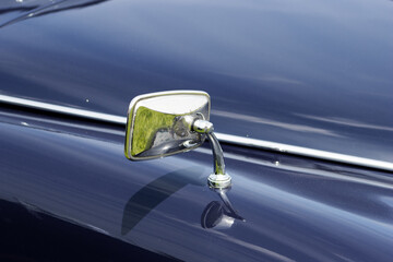 vintage car detail of a silver wing mirror