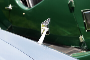 vintage car detail of a silver wing mirror