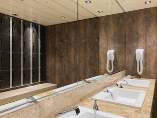 Metal hand air dryers with modern design tiles in bathroom on cruiseship or cruise ship liner