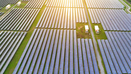 Green energy haven: A mesmerizing aerial view showcases a sprawling solar power plant, where nature and technology coexist harmoniously, creating a vibrant tapestry of renewable energy.
