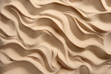 Fototapeta premium Rippling Sand Dunes Texture Close-up in Natural Light