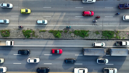 The motorway, snarled in a frustrating traffic jam, as seen from a drone's aerial perspective. A...