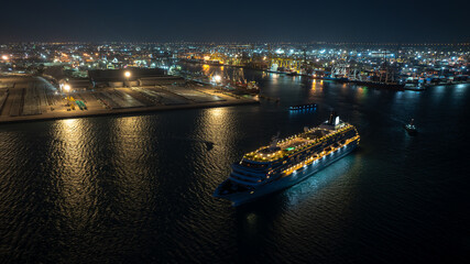 luxury cruise ship for first class passenger is sailing out of the port, motion effect low shutter...