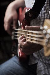 Guitar, hands and music with artist person closeup in recording studio for performance or...