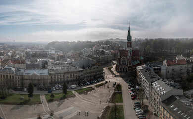 Aerial view of Podgorski Square with St. Joseph's Church during foggy morning in Podgorze District in Krakow, Poland