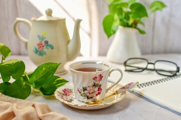 Afternoon tea , hot tea In a flower pattern tea cup, 