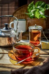 Thai hot tea on wooden blackground, retro style , morning light	
